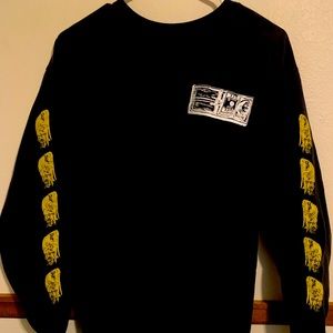 Black obey shirt with yellow on side and pink on bottom size mens L